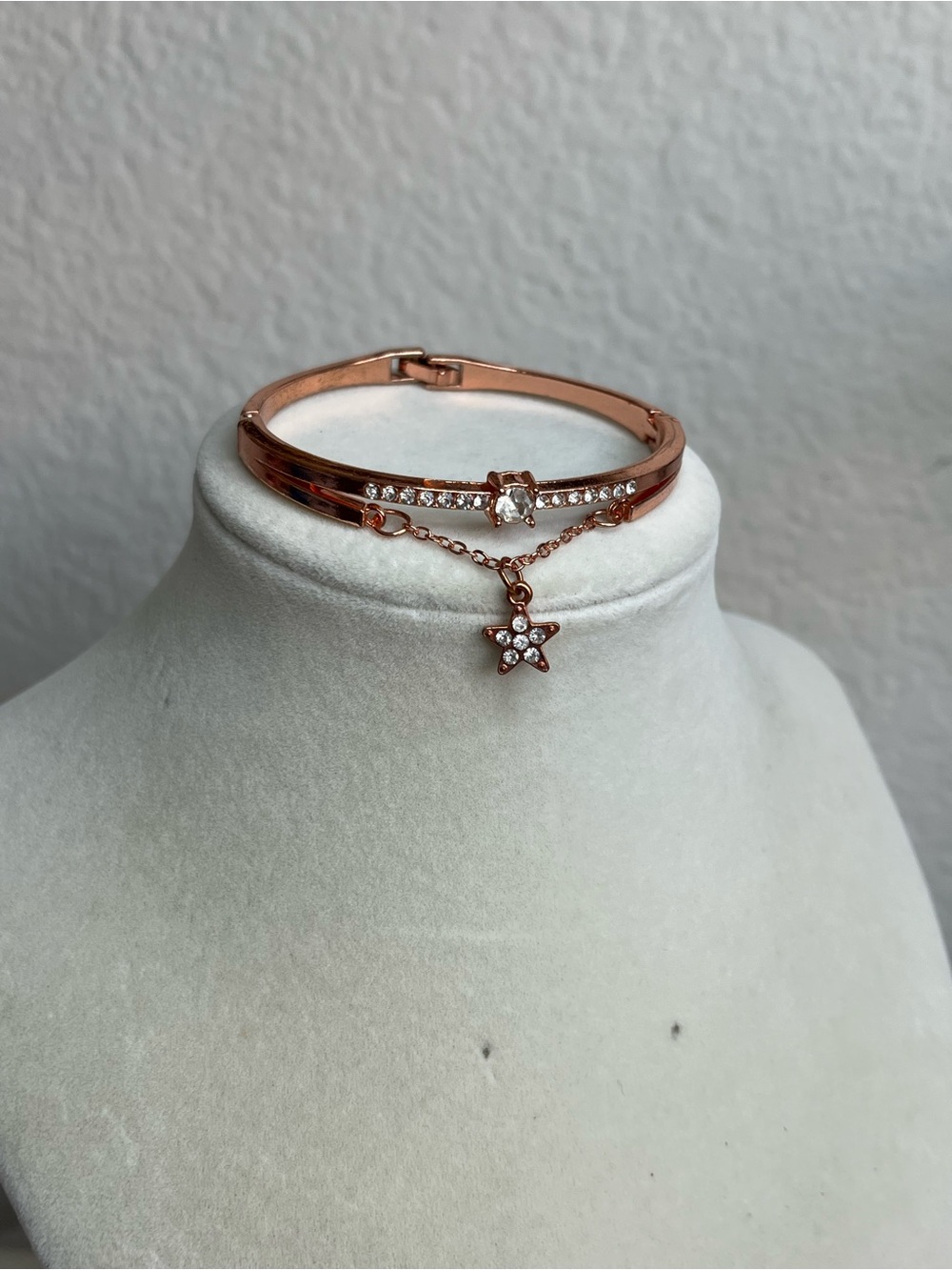 Rose gold tone rhinestone star dangle bangle bracelet